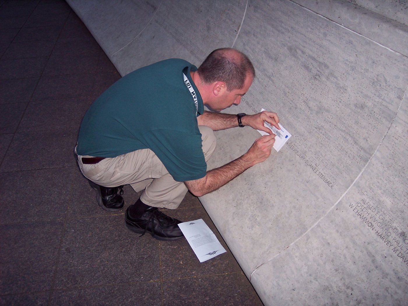 Paul Rickard making a rubbing at the Vietnam Veterans Memorial